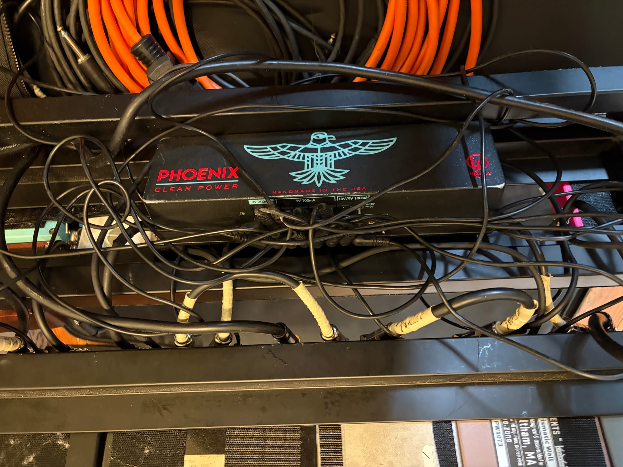 Nest of wires underneath the pedalboard