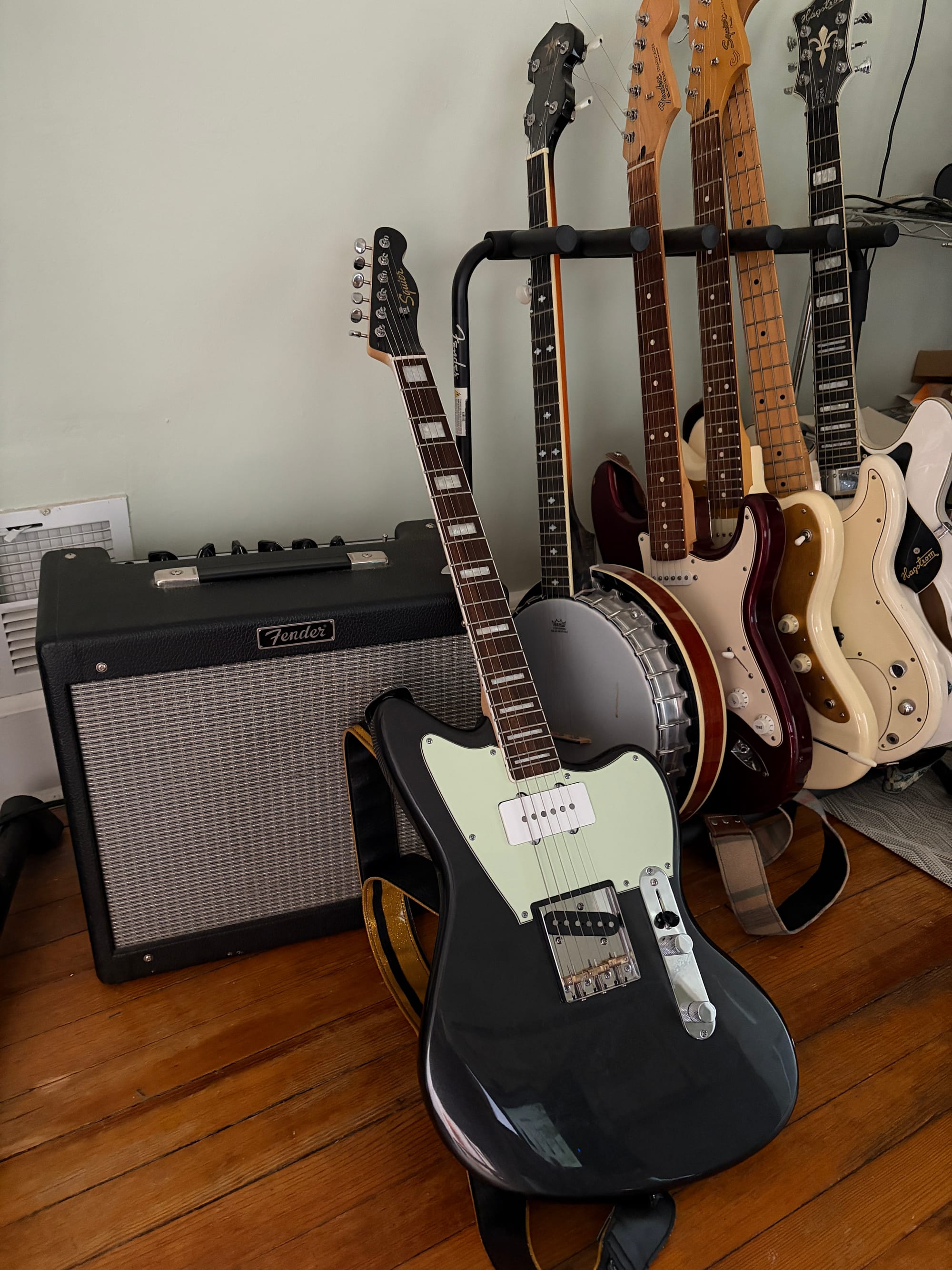 Squier Paranormal Telecaster propped up against an amp